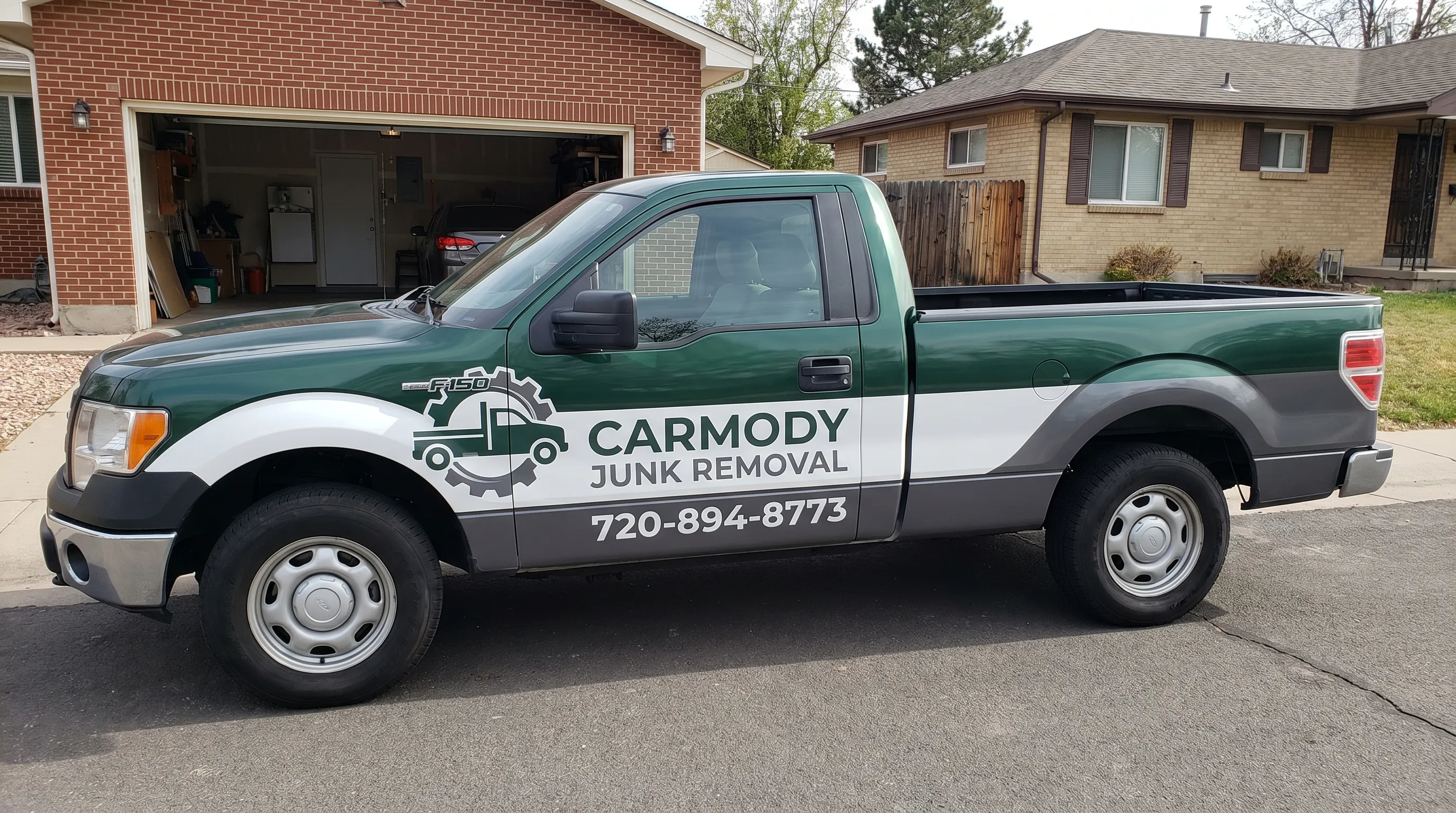 Carmody Junk Removal crew hauling junk in Denver, CO